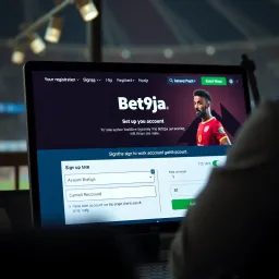 User logging into Bet9ja mobile platform showing username and password input on a smartphone